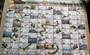 'Snakes and Ladders' board game found in Rafah by IDF soldiers showing pictures of sites in Israel for target.