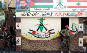  Members of the Popular Front for the Liberation of Palestine-General Command (PFLP-GC) stand guard during a parade marking the annual al-Quds Day, (Jerusalem Day), at Burj al-Barajneh Palestinian refugee camp in Beirut, Lebanon April 14, 2023.