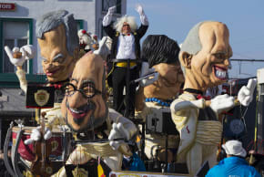 Giant figures depicting Belgian Prime Minister Charles Michel (C) and other politicians are seen dur