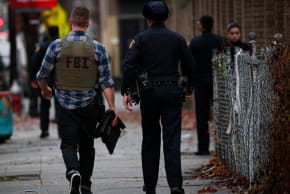 A FBI officer arrives at the scene of an active shooting in Jersey City, N.J., Dec. 10, 2019.