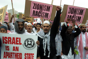 Demonstrators protest outside the opening session of the World Conference Against Racism (WCAR)