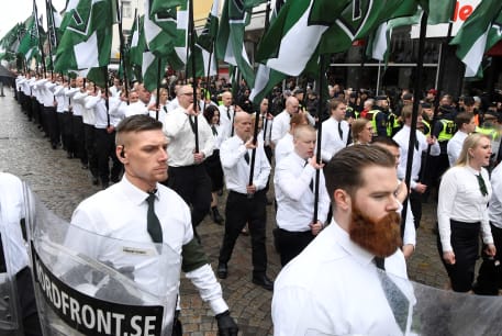 Members of the Neo-nazi Nordic Resistance Movement march through the town of Ludvika, 2018