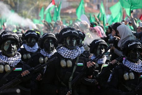  Members of Qassam Brigades choir attend a rally marking the 35th anniversary of the Hamas movement's founding, in Gaza City December 14, 2022. 
