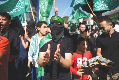  PALESTINIANS WAVE Hamas flags in the West Bank in solidarity with Gaza. Calls to restore the PA as the governing entity in Gaza are no less naïve than calls for a ‘two-state solution,’ argues the writer.