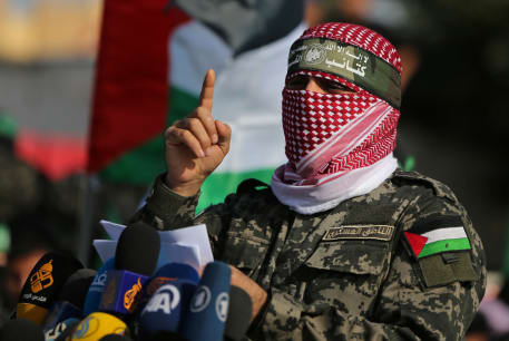  Abu Obaida, the spokesman of the Izz el-Deen al-Qassam Brigades, gestures as he speaks during an anti-Israel military show in the southern Gaza Strip November 11, 2019