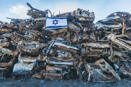  CARS DESTROYED by Hamas during the October 7 massacre are piled high in a field near the Israel-Gaza border.