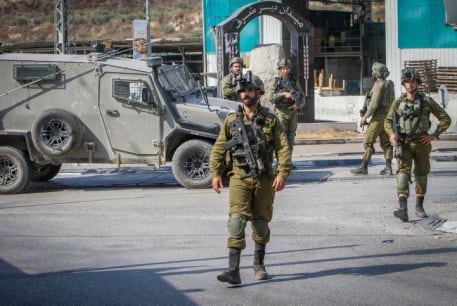  Israeli soldiers near the scene of a shooting, near the West Bank settlement of Shavei Shomron, on October 11, 2022