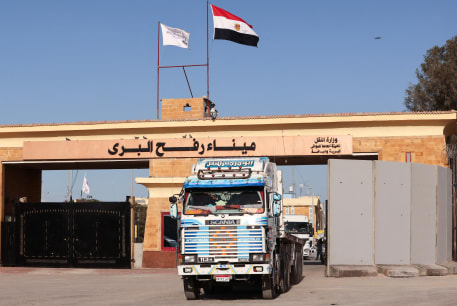  A truck crosses from Gaza to Egypt, at the Rafah border crossing between Egypt and the Gaza Strip, amid the ongoing conflict between Israel and Palestinian Islamist group Hamas, in Rafah, Egypt