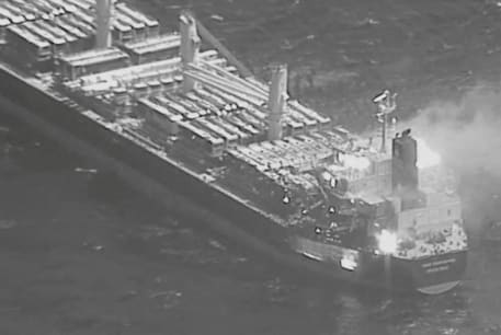  An aerial view of the Barbados-flagged ship True Confidence ablaze following a Houthi missile attack at sea, March 6, 2024, in this handout photo.