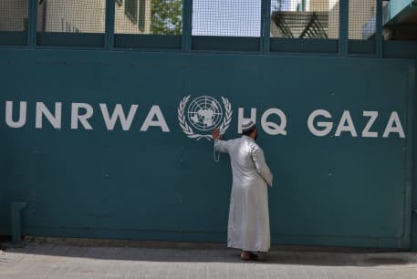  A Palestinian man waits outside of the UNRWA headquarters building in Gaza City on April 6, 2013.