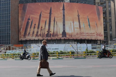  An anti-Israel billboard with a picture of Iranian missiles is seen in a street in Tehran, Iran April 15, 2024. 