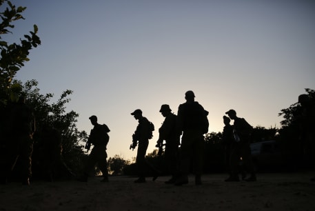  Bedouin Arab Israeli Defense Force soldiers take part in a night-time tracking drill near Tze'elim in southern Israel June 9, 2014.