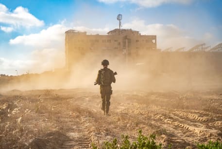  An IDF soldier walks through the Gaza Strip.