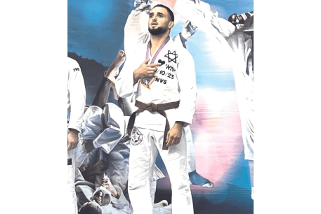 YARIN SHRIKI, survivor of the Nova festival massacre, last month won a gold medal at the Paris Grand Prix, dedicating the victory to his fallen friend, Yochai Ben-Zechariah, whose name he wears on his kimono, next to the date October 7, 2023