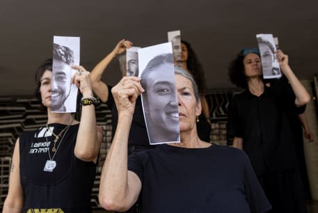 Relatives hold pictures of hostages kidnapped during the deadly October 7 attack, in Tel Aviv, Israel, May 23, 2024