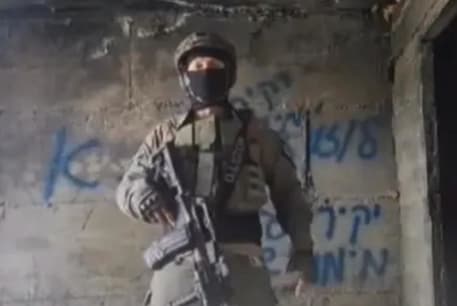 Masked soldier or reservist under investigation by the IDF for encouraging rebellion against Gallant and Halevi.