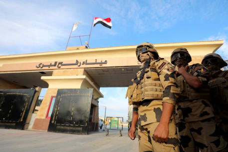  Military personnel stand guard on the Rafah border crossing between Egypt and the Gaza Strip, October 31, 2023