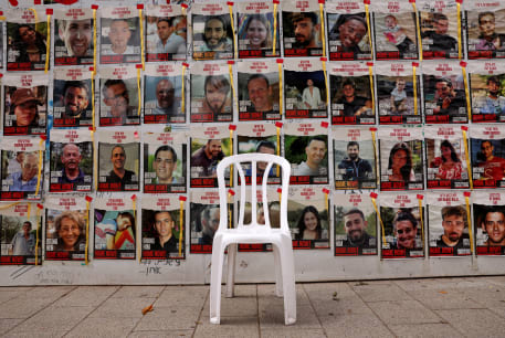  A chair is left in front of posters with pictures of hostages, who were kidnapped during the deadly October 7 attack on Israel by Palestinian Islamist group Hamas, amid the ongoing conflict in Gaza between Israel and Hamas, in Tel Aviv, Israel, April 26, 2024. 