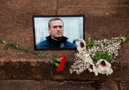  Flowers and a portrait of Russian opposition leader Alexei Navalny are seen near Russia's embassy
