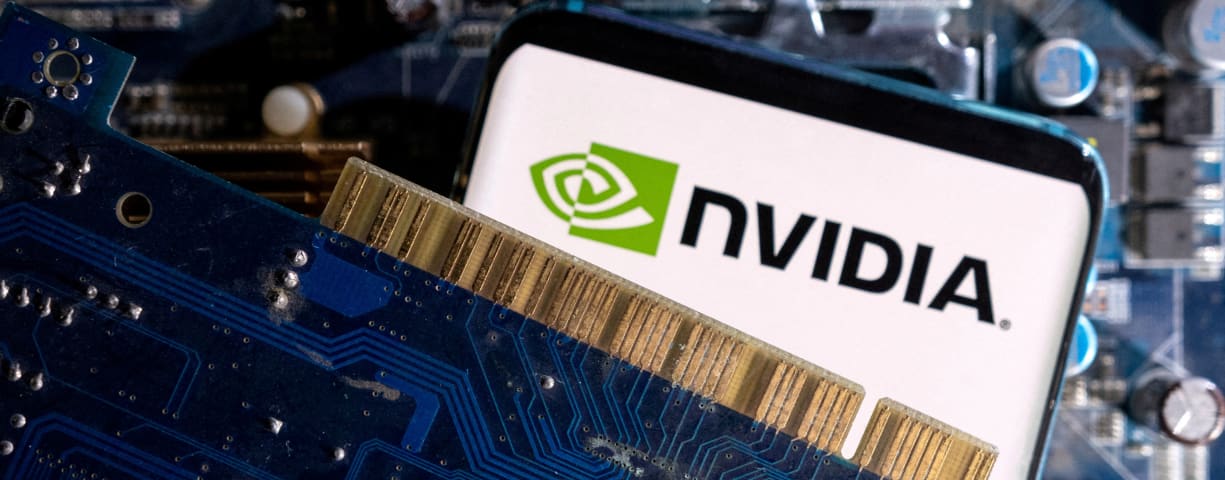   A smartphone with a displayed NVIDIA logo is placed on a computer motherboard in this illustration taken March 6, 2023