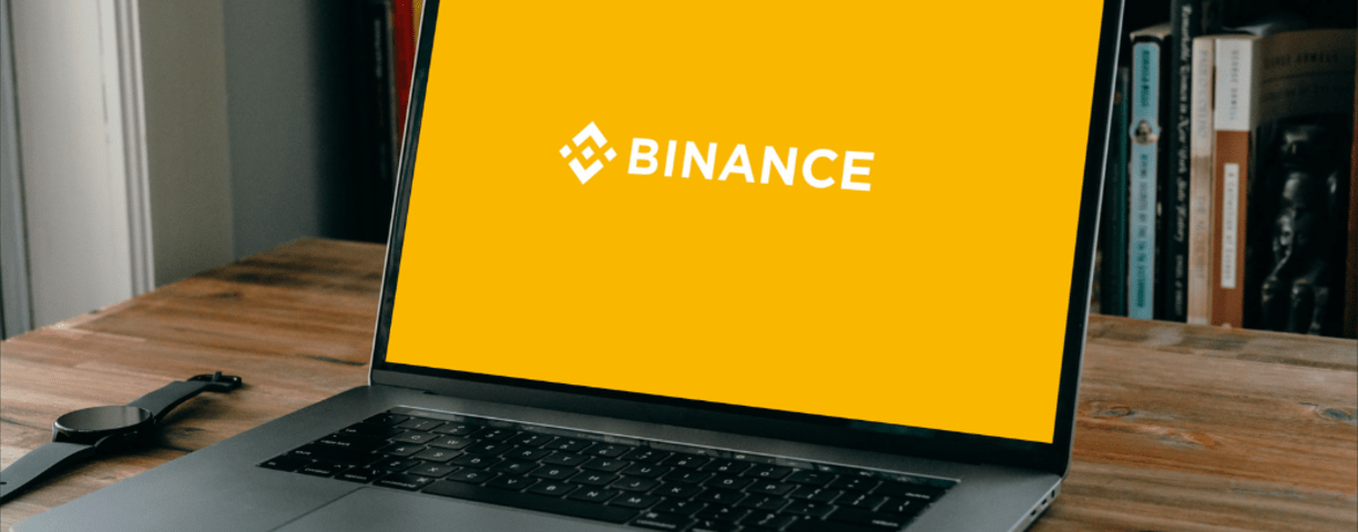  Binance with their logo on a laptop