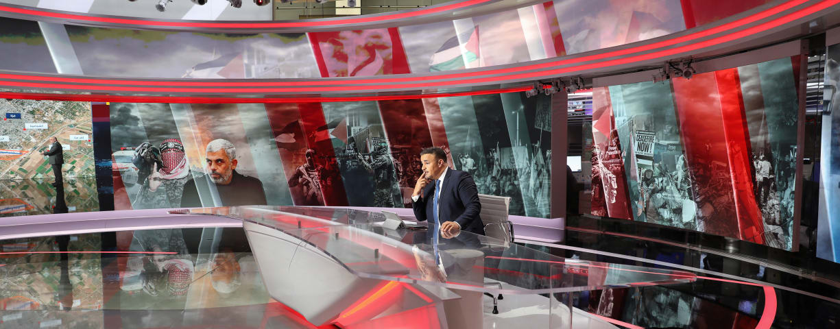  Al Jazeera presenter Abdelkader Aiad works during a live newscast at a studio, in Doha, Qatar, May 5, 2024.