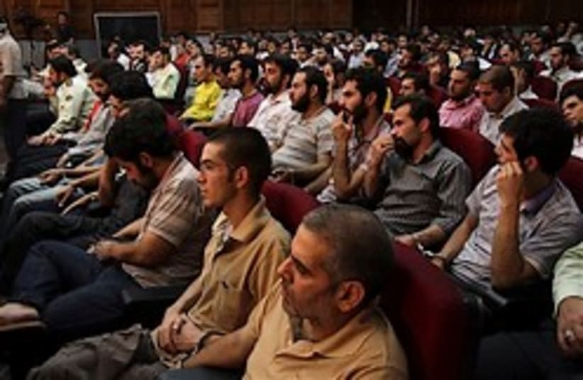 Defendants sit at a court room in Teheran, Iran, S (photo credit: AP)