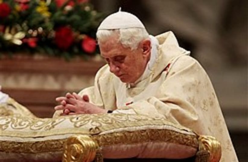 Pope kneels 248.88 (photo credit: )