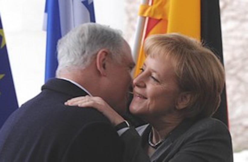 Netanyahu embraces Merkel, Monday. (photo credit: GPO)