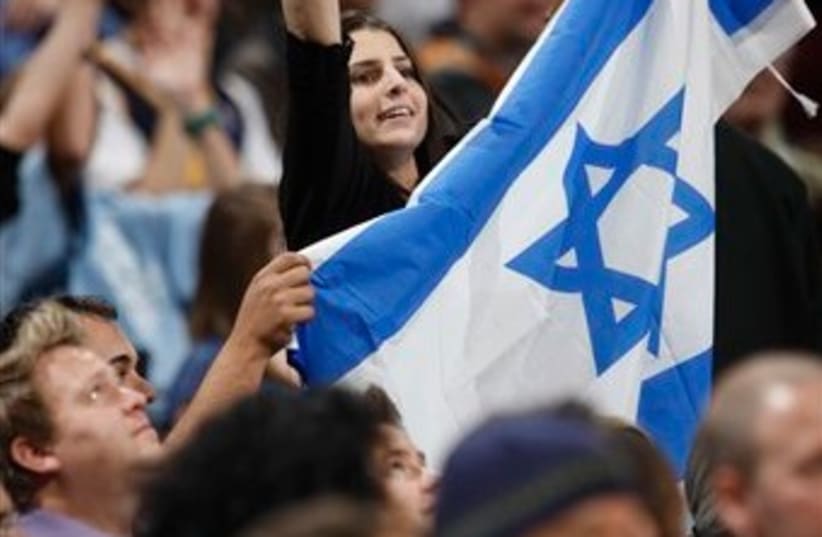 casspi fan israel flag 512 ap (photo credit: AP)