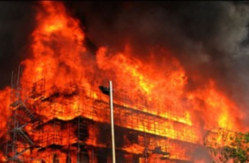 building on fire (photo credit: illustrative)