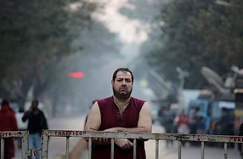 sad white man after mumbai bombing near chabad house 311 ap (photo credit: ASSOCIATED PRESS)