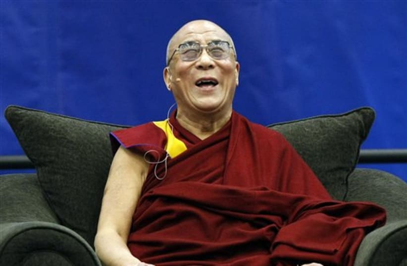  The Dalai Lama laughs (photo credit: AP)