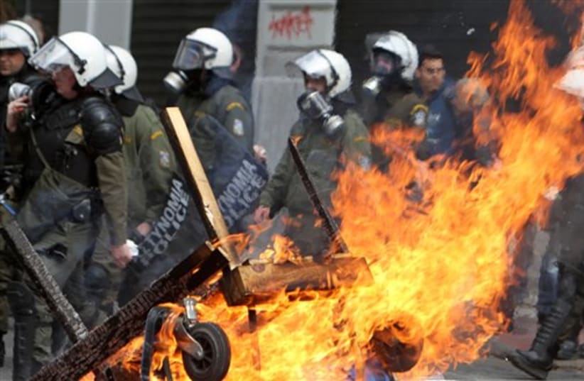 Riot police in Athens, Greece (photo credit: AP)