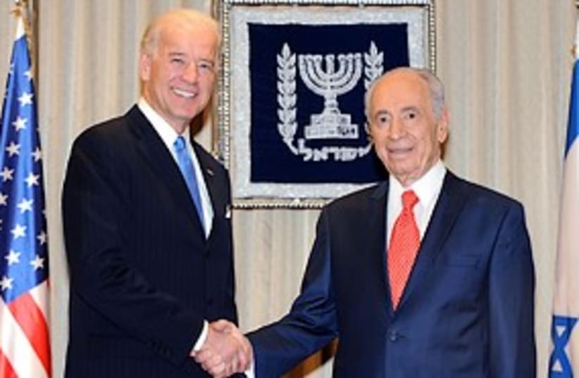 biden and peres shake hands in israel 311 GPO (photo credit: GPO)