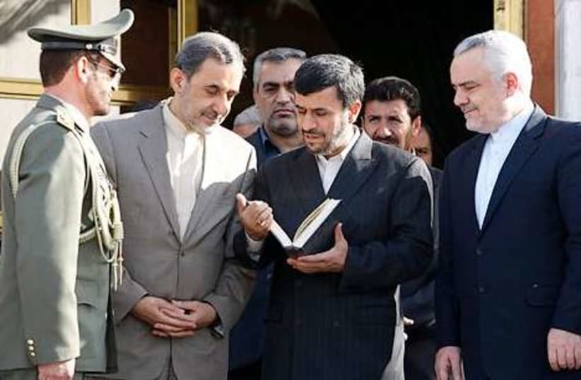 ahmadinejad Koran 311 (photo credit: Associated Press)