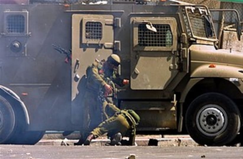 soldier falls in Nablus  (photo credit: AP)