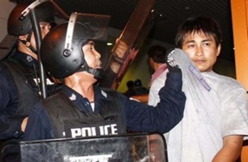 Thai protester arrested (photo credit: ASSOCIATED PRESS)