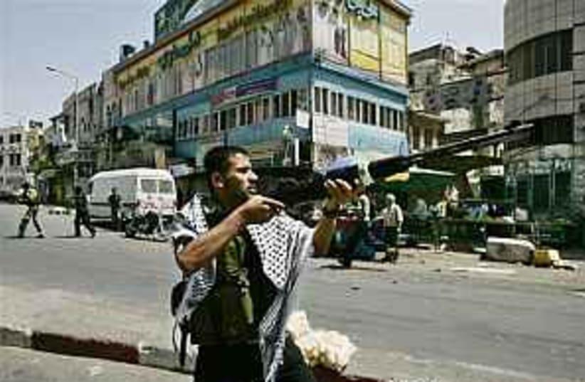 A Fatah gunman in Nablus (photo credit: AP)