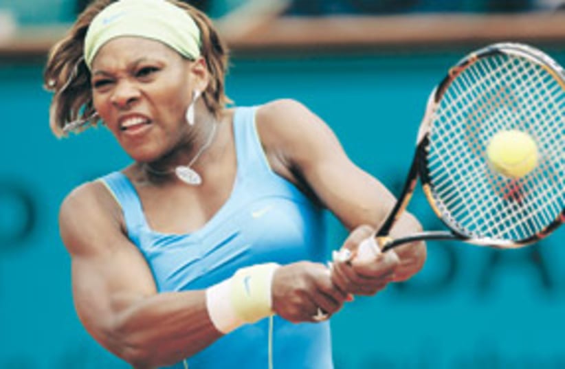 Serena Williams smashing tennis ball 311 (photo credit: Michel Spingler/AP)