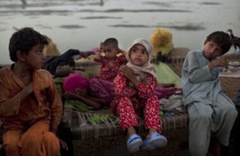 Pakistani children after floods (photo credit: ASSOCIATED PRESS)