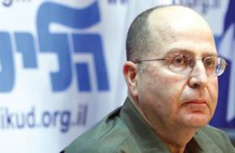 Moshe Ya’alon serious with Likud sign 311 (photo credit: Ariel Jerozolimski)