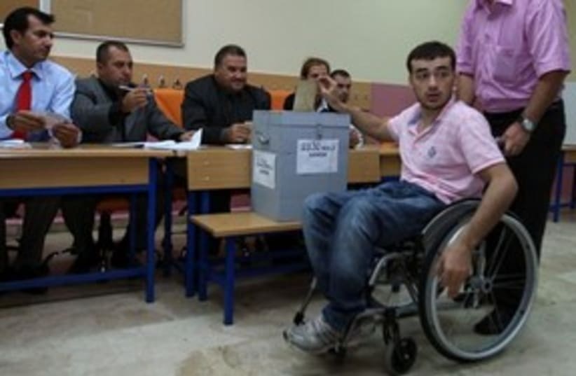 Turkish man in wheelchair votes 311 (photo credit: AP Photo/Burhan Ozbilici)