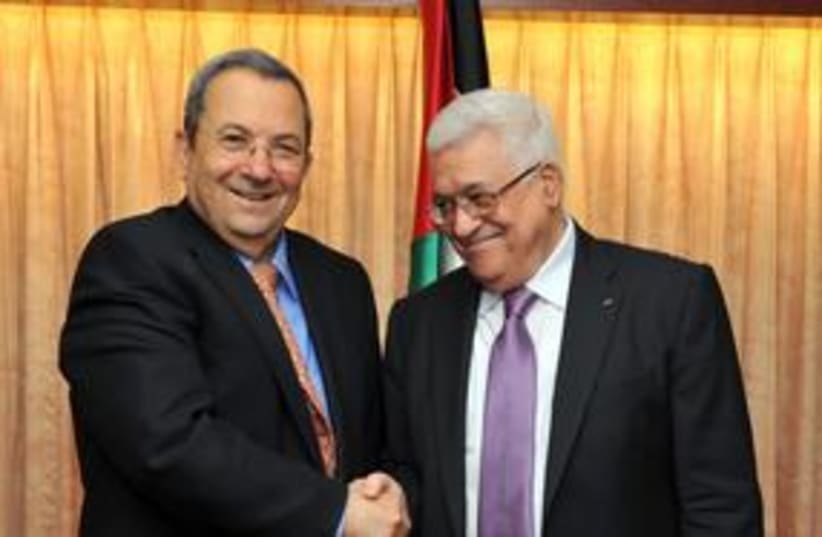 Barak and Abbas shaking hands 311 (photo credit: Ariel Harmoni, Defense Ministry)