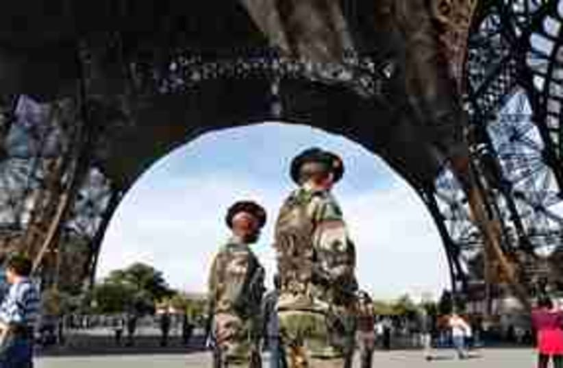 311_Eiffel Tower troops (photo credit: Associated Press)
