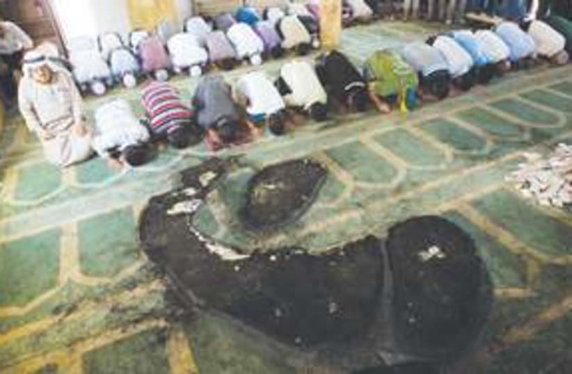 311_burn mosque (photo credit: Associated Press)