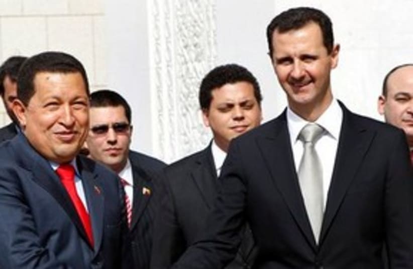 Chavez Assad shaking hands 311 (photo credit: AP Photo/Hussein Malla)