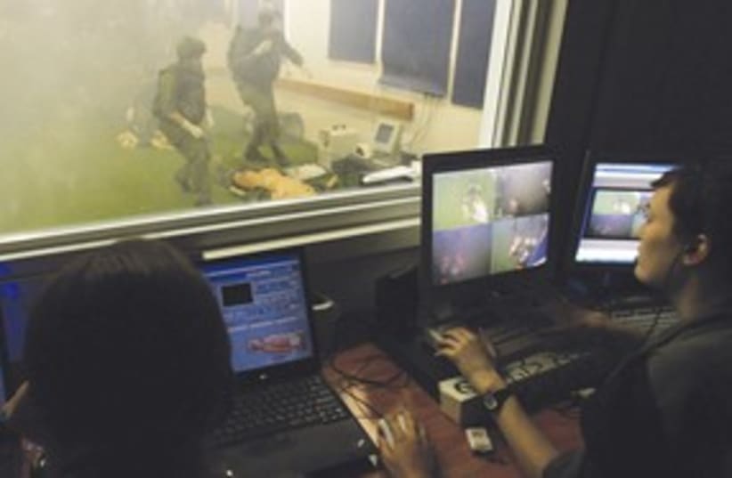 female IDF soldiers watch computer screens 311 (photo credit: AP)