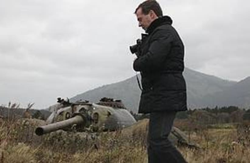 Medvedev visits one of the Russian-held islands claimed by J (photo credit: Associated Press)