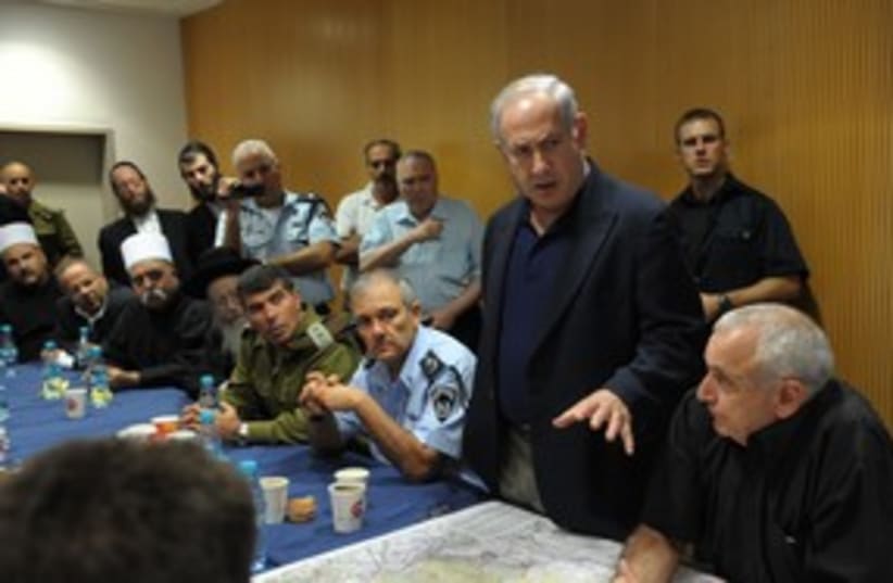 Binyamin Netanyahu fire meeting 311 (photo credit: GPO / Amos Ben-Gershom)